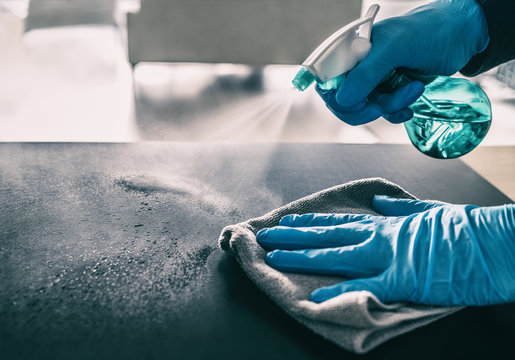 Professional cleaner detailing a home surface